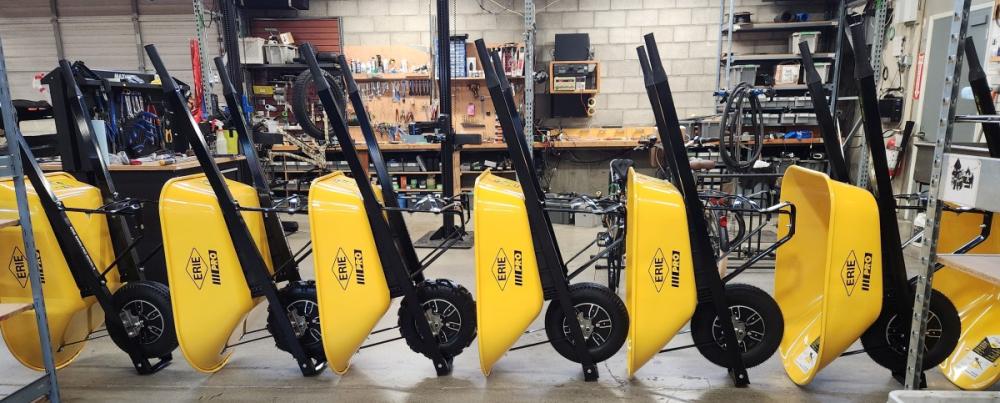 Row of Wheelbarrows Getting Assembled