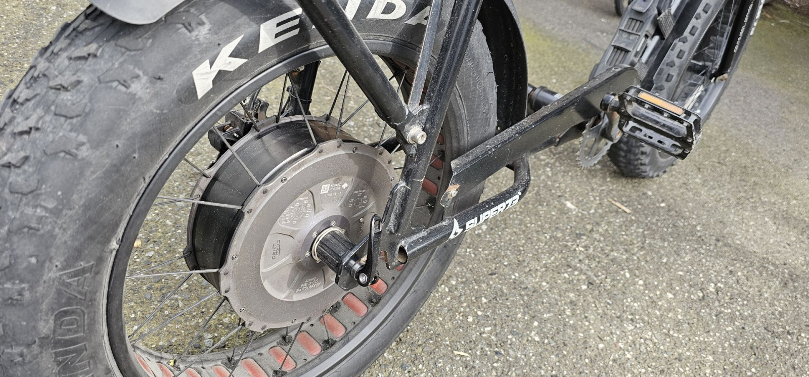 The bike is short, so I don't pedal, and this is a throttle-only build. I have no chain, lol.