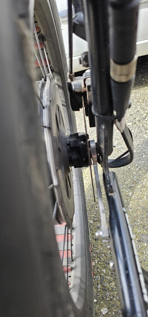 I used a spacer between the torque arm and the kickstand mount plate so that the torque arm is correctly installed and not bent.