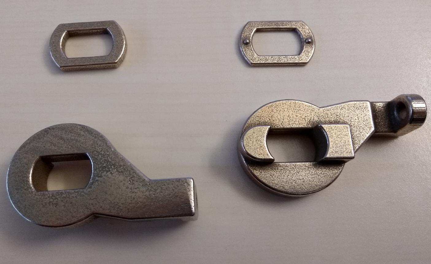 I had the torque arm with an integrated chain tensioner 3D-printed in metal. The files can be found here:
https://www.thingiverse.com/thing:5202576