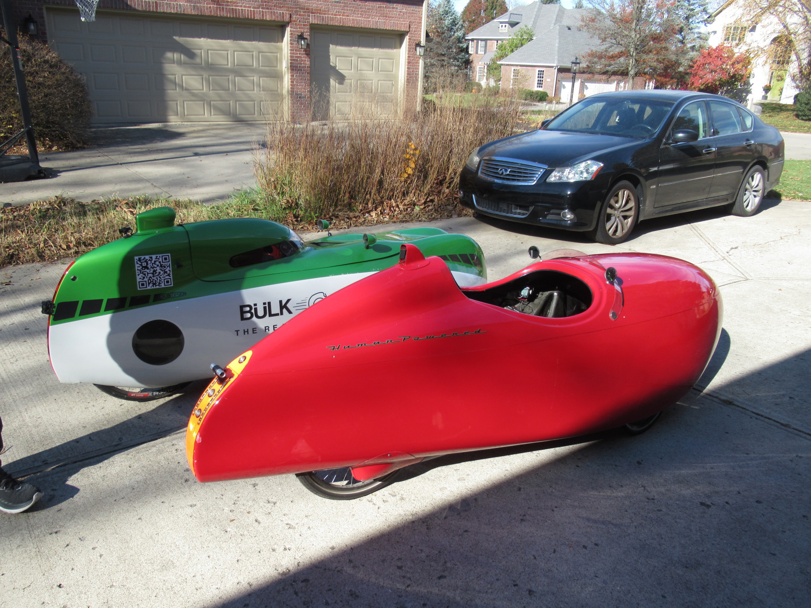 Foreground is the vehicle I eventually bought, in a driveway in Indianapolis, Indiana. Behind it is the vehicle the seller had upgraded to.