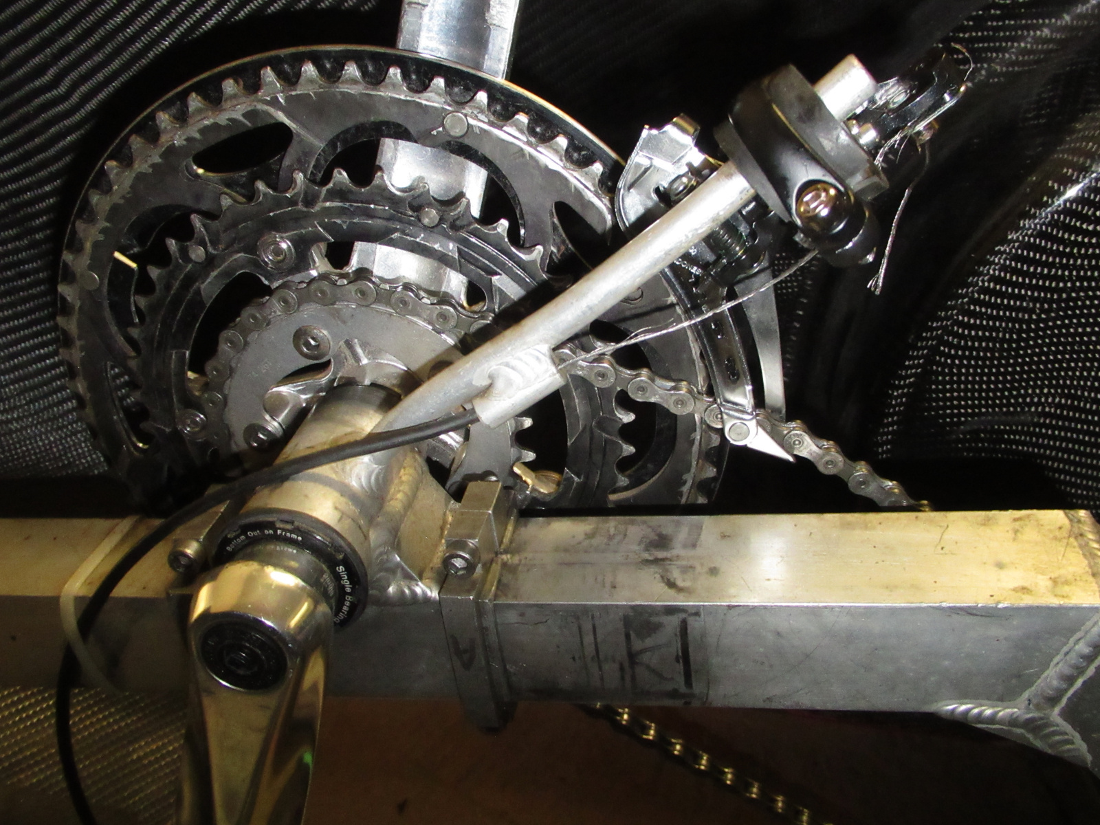 As purchased, the front derailleur was not correct for the triple ring setup in the front. I would also have to install shorter cranks in order for my big feet to flail freely within the fairing.