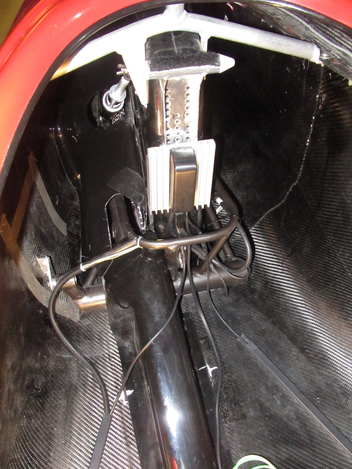 Same view, interior area behind the seat. Phaserunner controller has been installed on an oversized heat sink (since airflow will be minimal) along with cabling. Protective shrouds over the drive train are also in place.