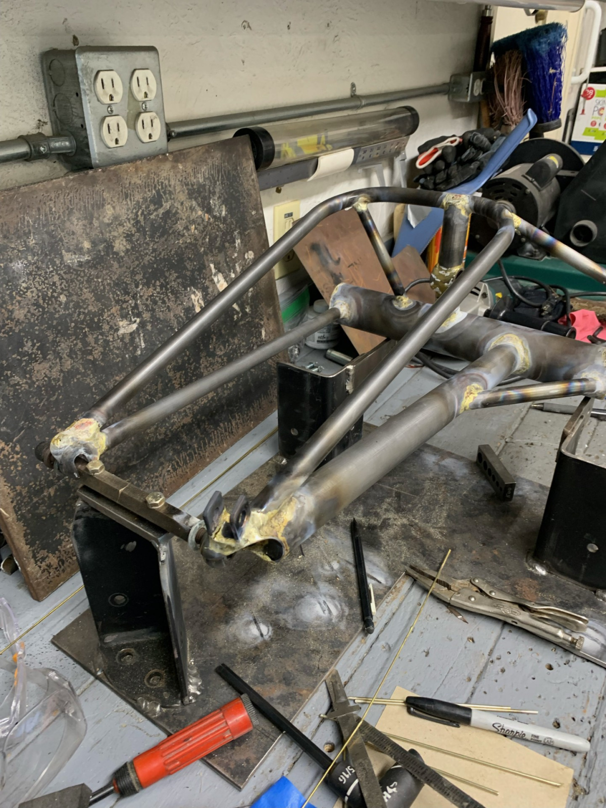 The new swingarm, constructed of thin-walled chromolly tubing, after brazing in its fixture.