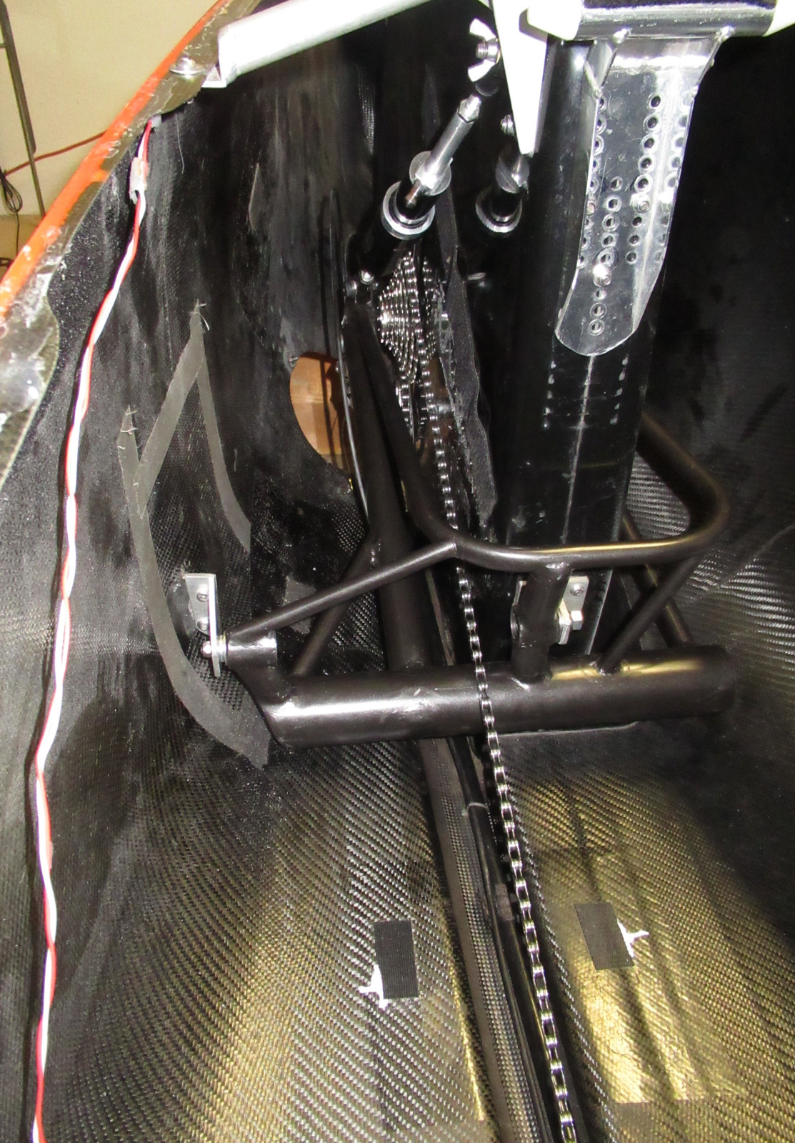 Wheel has now been mounted, and we see the drive chain and air shock in place.