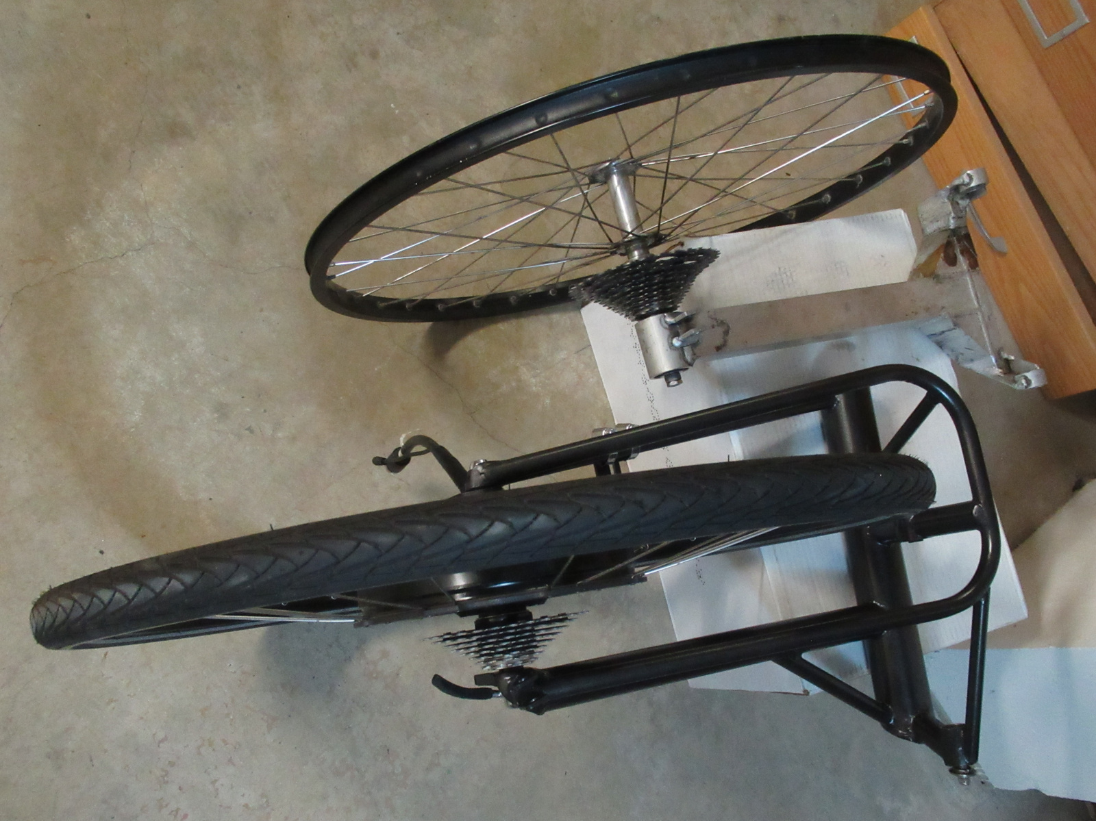 The old assembly (above) compared with the new. Same mounting points in the body are used.