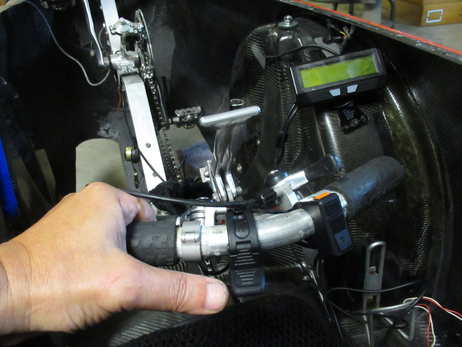 Steering of the front two wheels is effected with this T-handle through a universal joint. Cycle Analyst computer is visible to the right.
