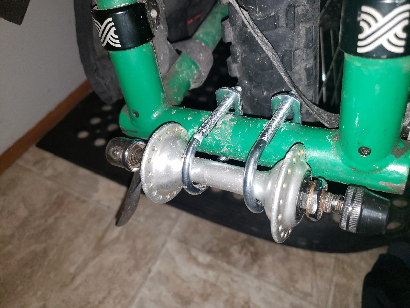The first version of the tow hitch. I've since added some hose clamps for more strength, and some old inner tube for protecting the frame.