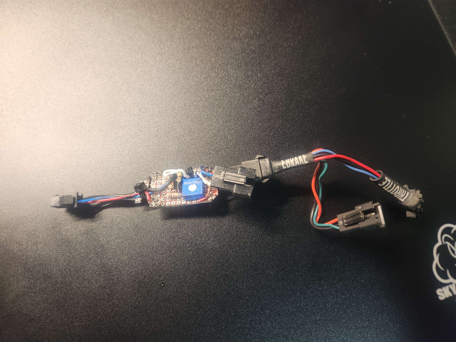 Albert designed this small PCB for the original e-bike, but it was just a PCB wrapped in tape and I cracked it while unraveling it. This PCB allows me to use two different sources of analog regen (thumb throttle and analog brake lever) with the CA.