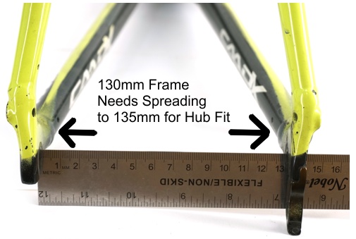 A bike frame with 130mm rear dropout that would need to be spread for a motor fit