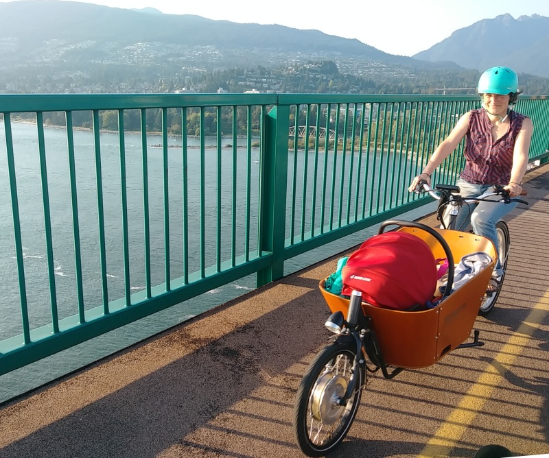 AnSo and Andina over lions gate bridge on a happy cargo bike adventure.