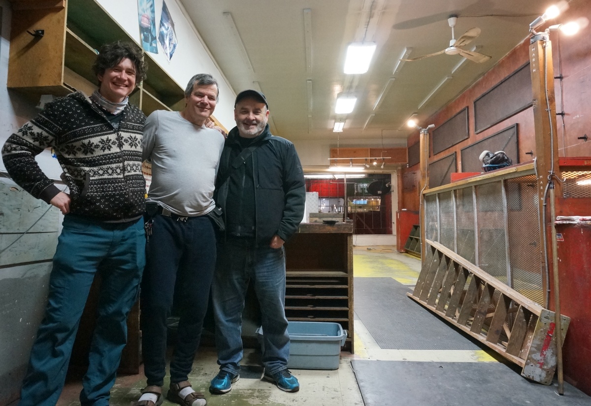 Brock (center) in the cleared out cambie cycles shop. After the party and before an epic ping-pong showdown.